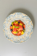 Mixed fruit salad served on a plate