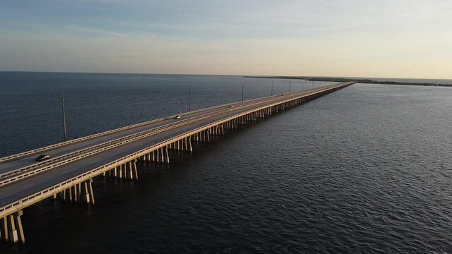 View of Seven Mile Bridge with passing cars. Monroe County, Florida, United States.
