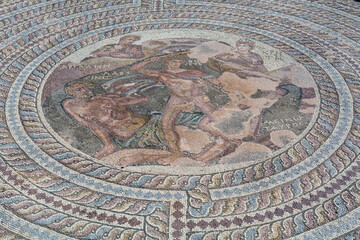 old mosaic in paphos, cyprus with an antique roman ruin