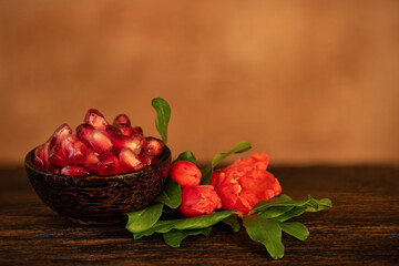 Pomegranate on an old wooden background.