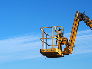 Industrial boom lift reaching high up