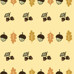 Cute hand-drawn acorns and oak leaves seamless pattern, a fall season yellow background