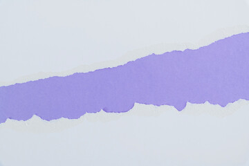 Torn paper on purple background