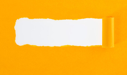 Yellow torn paper on white background
