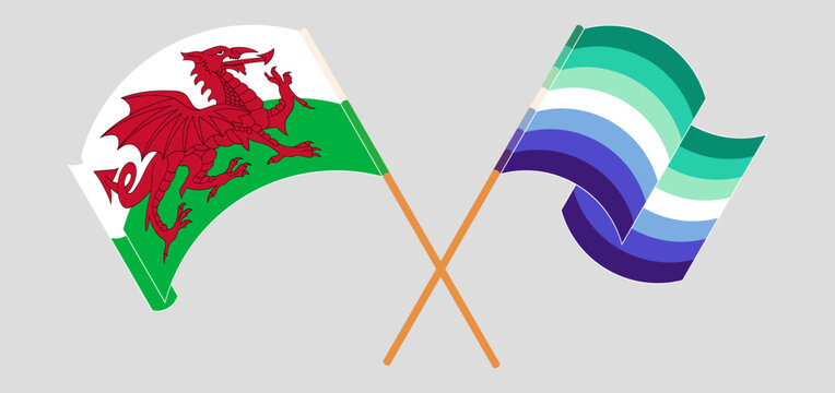 Crossed and waving flags of Wales and gay men pride