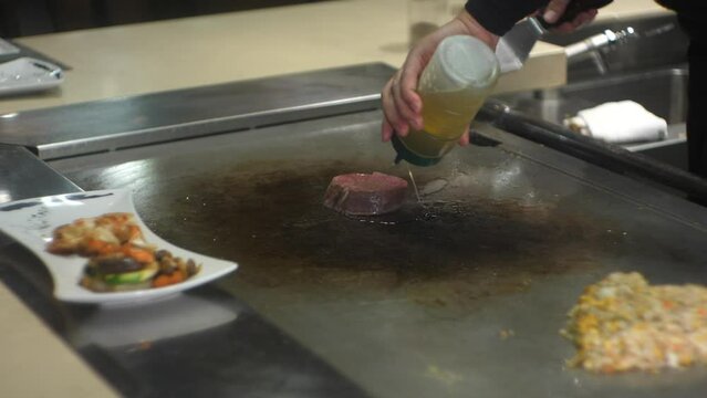 adding oil to the chicken frie