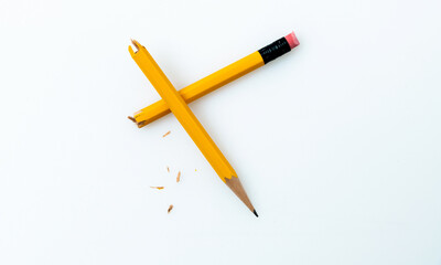 Broken pencil on white background