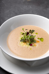Vegetable cream soup with microgreens