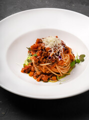Bolognese pasta on a white plate. Different angles.
