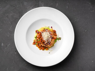 Bolognese pasta on a white plate. Different angles.