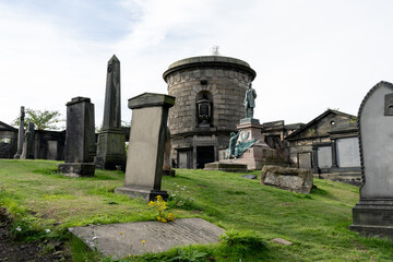 Fototapeta na wymiar A stroll through the Edinburgh Cemetery, which is richest in history and terror