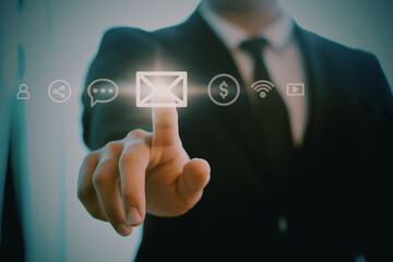 Finger of businessman pressing virtual button