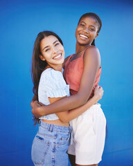Diversity, friends and women hug with happy smile and woman friendship. Portrait of people smiling...