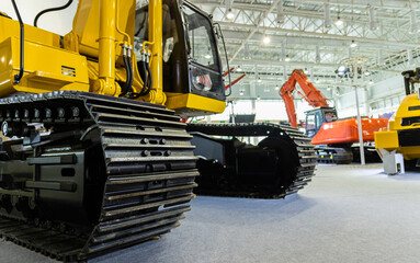 Close up of excavator wheel in exhibition hall