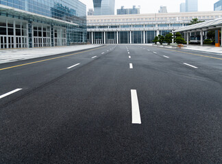 Fototapeta premium Asphalt road with white dashed lines