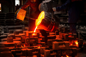 Liquid iron from metal ladle pouring in castings at factory
