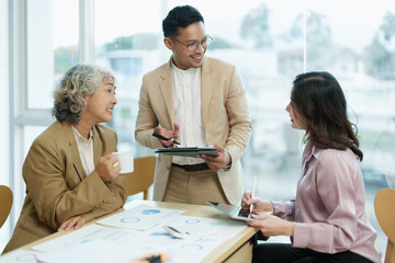 Asian entrepreneurs and business people meeting in a conference room in business planning, financial budget and investment risk assessment to analyze customer groups to increase company growth