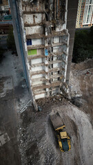 A dilapidated building demolition and construction site