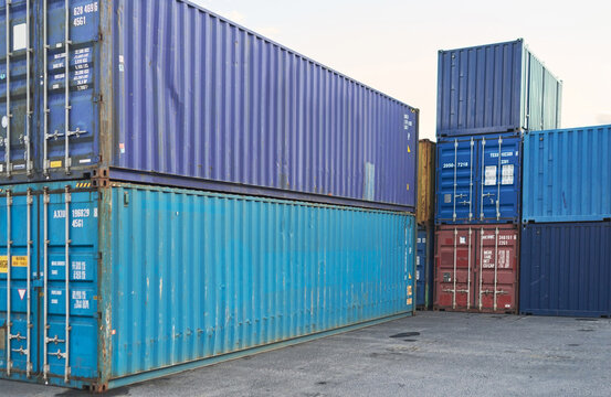 Container, logistics and port at storage in shipyard for global supply chain on sea. Shipping, cargo and transport distribution of goods, for import and export at international harbour in Cape Town