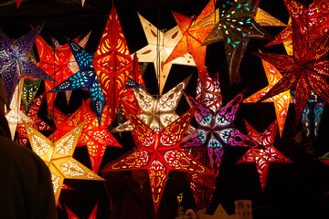 colorful paper stars on Christmas market                              