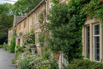 Fototapeta na wymiar honey coloured Cotswold stone houses in Castle Combe Wiltshire England often named as the prettiest village in England 