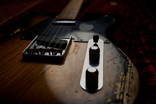 Old guitar with black background