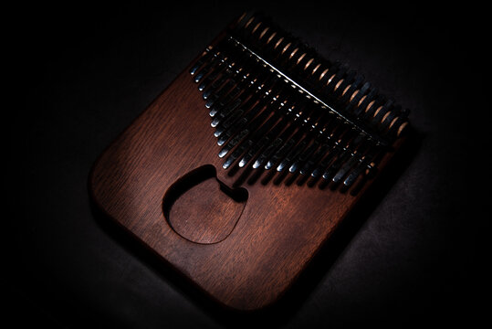 Kalimba or mbira is an African musical instrument. Kalimba is made of wood with metal to create sound. separately on cement floor