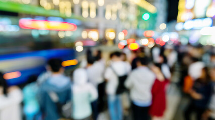 Group of people waiting to cross the crosswalk