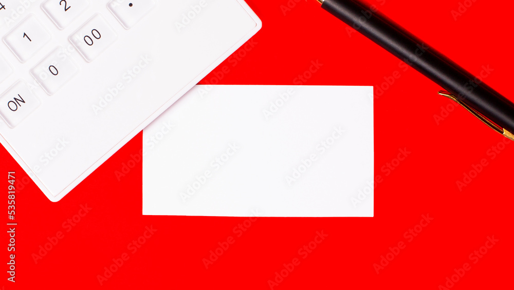 Aufkleber mockup on red background with white calculator, pen and white clean paper with space to insert text