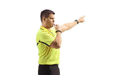Profile shot of a football referee blowing a whistle