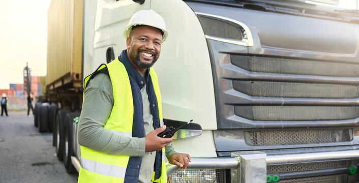 Construction Worker In Shipping Business By Delivery Truck In Shipyard. Black Man Truck Driver With Walkie Talkie Doing Logistics, Transport And Export Of Cargo Container In Distribution Industry