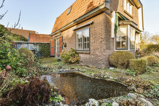 Brick House With Neat Patio And Pond