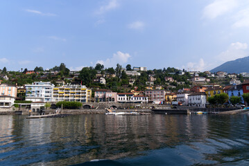 Lake shore of Lake Lago Maggiore at village Ascona, Canton Ticino, on a sunny summer day. Photo taken July 24th, 2022, Ascona, Switzerland.