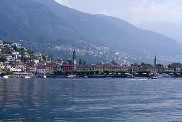 Beautiful view of village Ascona, Canton Ticino, on a sunny summer day with Lago Maggiore in the foreground. Photo taken July 25, 2022, Ascona, Switzerland.
