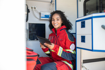 Paramedic posing for the camera in the medical emergency vehicle
