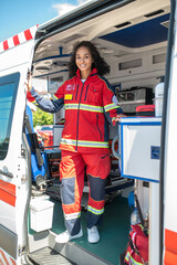 Joyous paramedic posing for the camera in the ambulance car © zinkevych