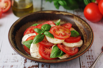 A bowl with traditional Italian caprese salad