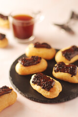 Traditional French dessert - eclairs with a cup of coffee