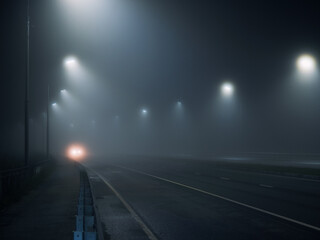 foggy road. night highway illuminated by lanterns