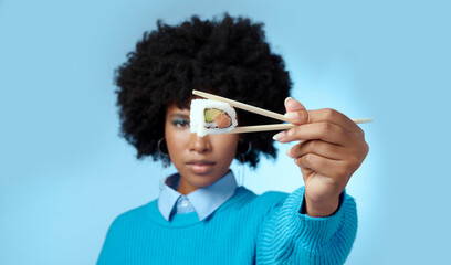 Food, studio and black woman with sushi in a portrait eating a Japanese diet with mockup space...