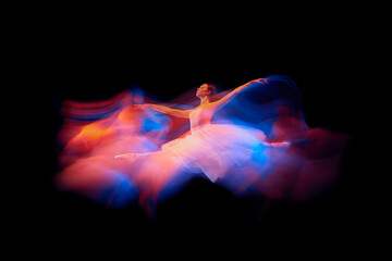 Futurism, fantasy, miracle. Graceful and fragile ballerina in ballet dress jumping isolated over...