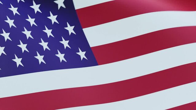 Close up of the USA american flag Stars and Stripes waving in the wind. Red and white stripes, white stars against a blue background. 4K high definition.