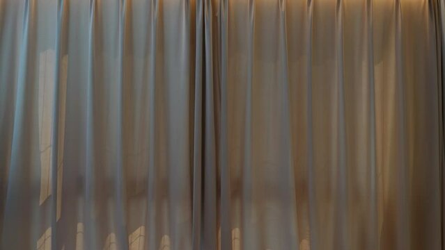 Motorized curtains in a modern bedroom in action