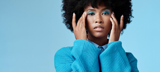 Blue makeup, fashion and beauty with a black woman in studio against a wall background with mockup....