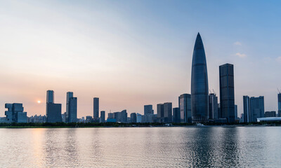 Office building reflected in the water at sunset