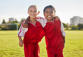 Portrait, girl friends and smile on football field training for match, game or competition. Soccer, sports and kids on grass pitch learning ball sport for wellness, health and fitness exercise.