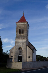 Fototapeta na wymiar old Bohemian country church with blue sky background