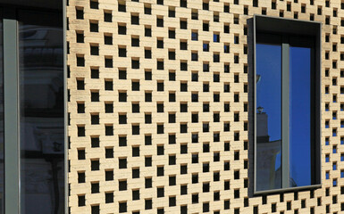 Windows of office building. Hinged and ventilated facade. Honeycomb and mosaic form of building...