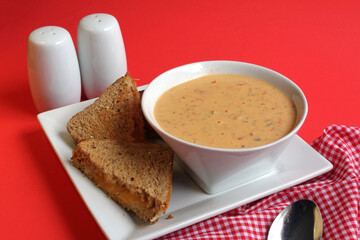 Creamy Thai soup with a grilled cheese sandwich