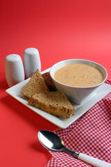 Creamy Thai soup and a grilled cheese sandwich, with space for text.